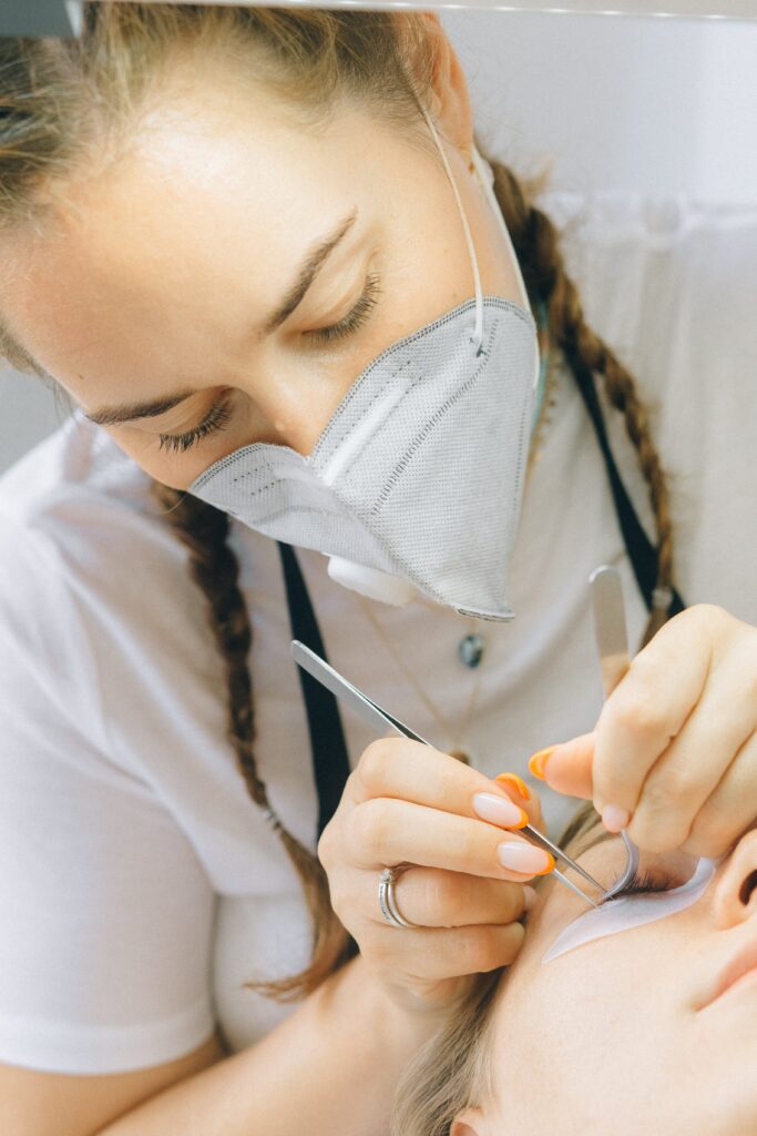 Woman in Putting Eyelash Extension